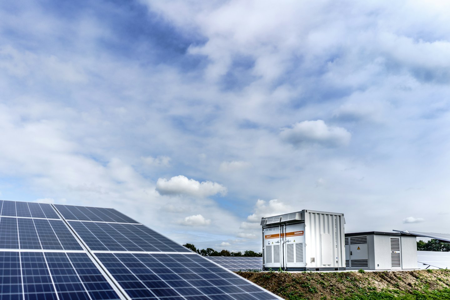 Rows of solar panels power a clean energy installation.